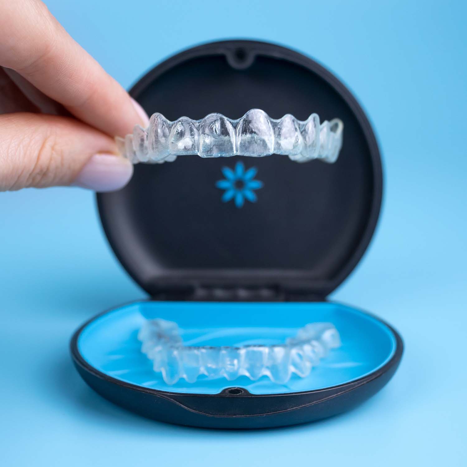 Close-up of a custom clear Invisalign aligner tray used for teeth straightening in Sri Petaling